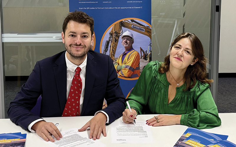  Jack Abbott and Julia Pyke signing a jobs pledge for Ipswich